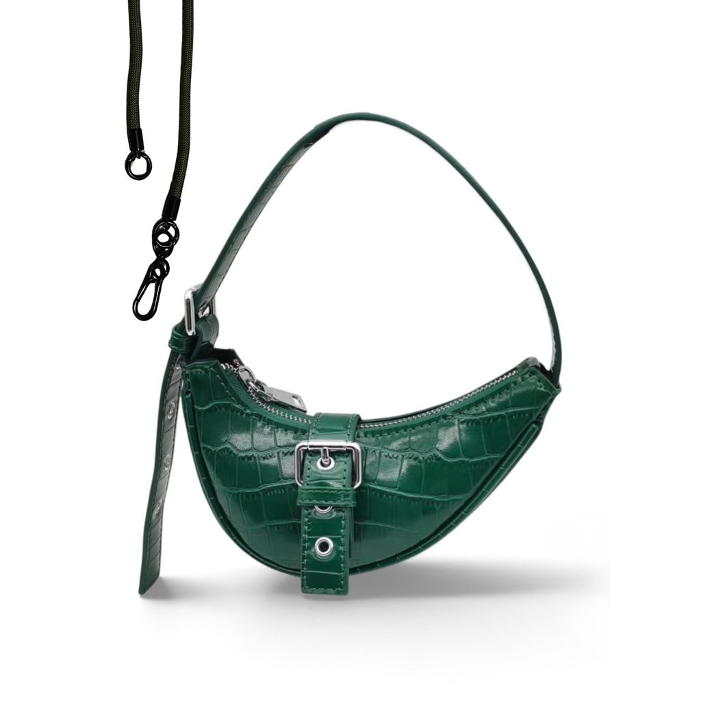 A green crocodile-embossed crescent-shaped shoulder bag with a matching adjustable shoulder strap and a black detachable crossbody strap, shown on a white background.