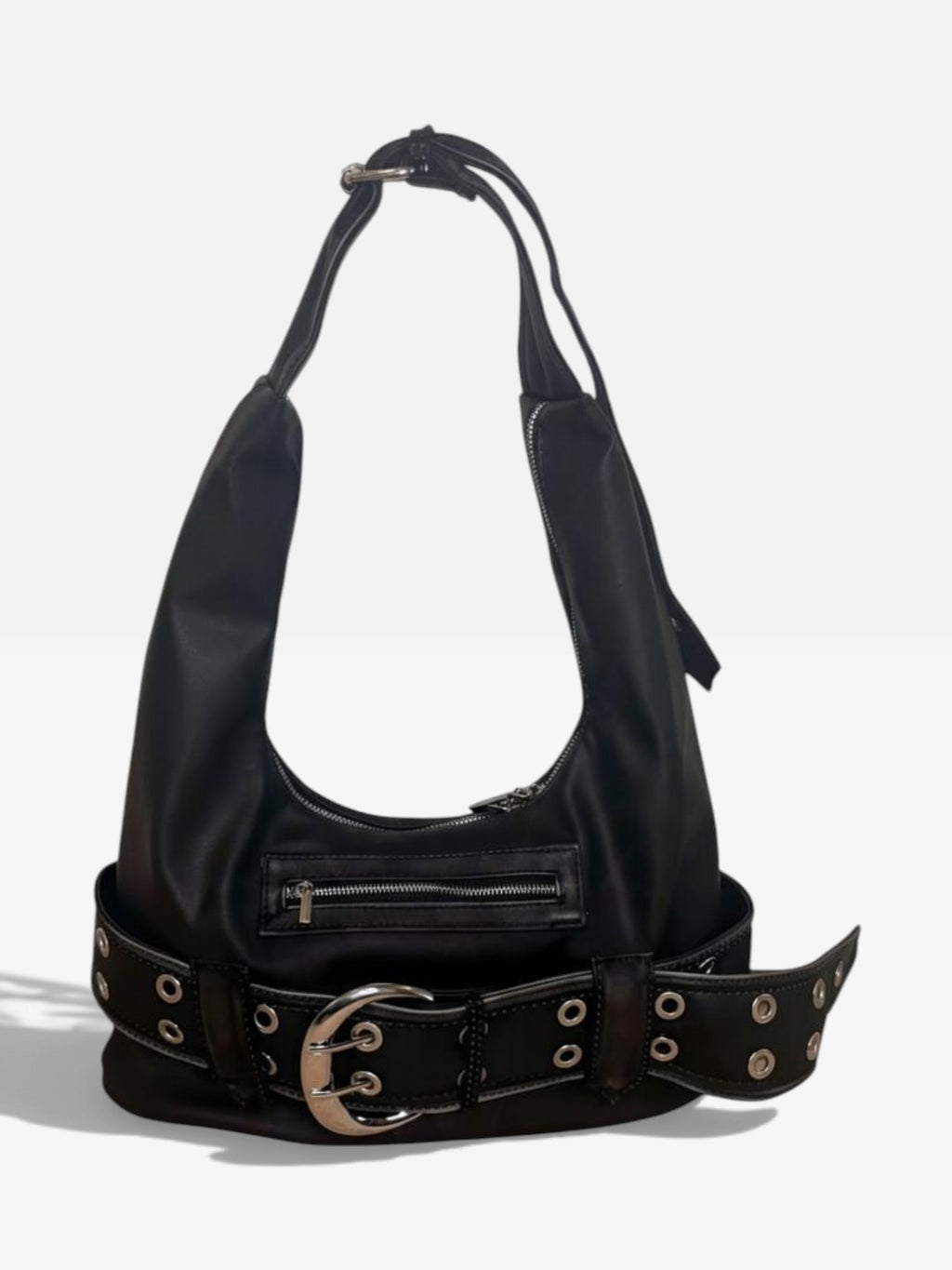 Washed black vegan leather shoulder bag with a chunky eyelet belt and oversized silver buckle on a white background