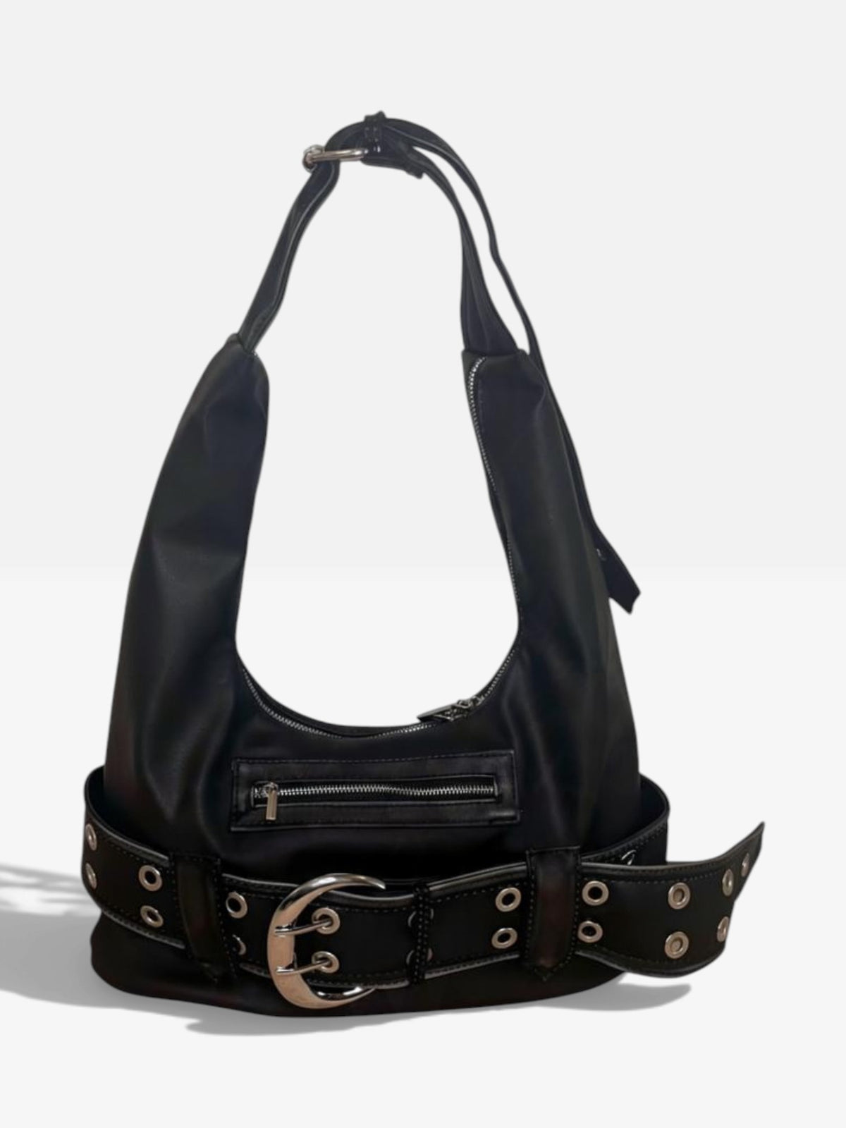 Washed black vegan leather shoulder bag with a chunky eyelet belt and oversized silver buckle on a white background